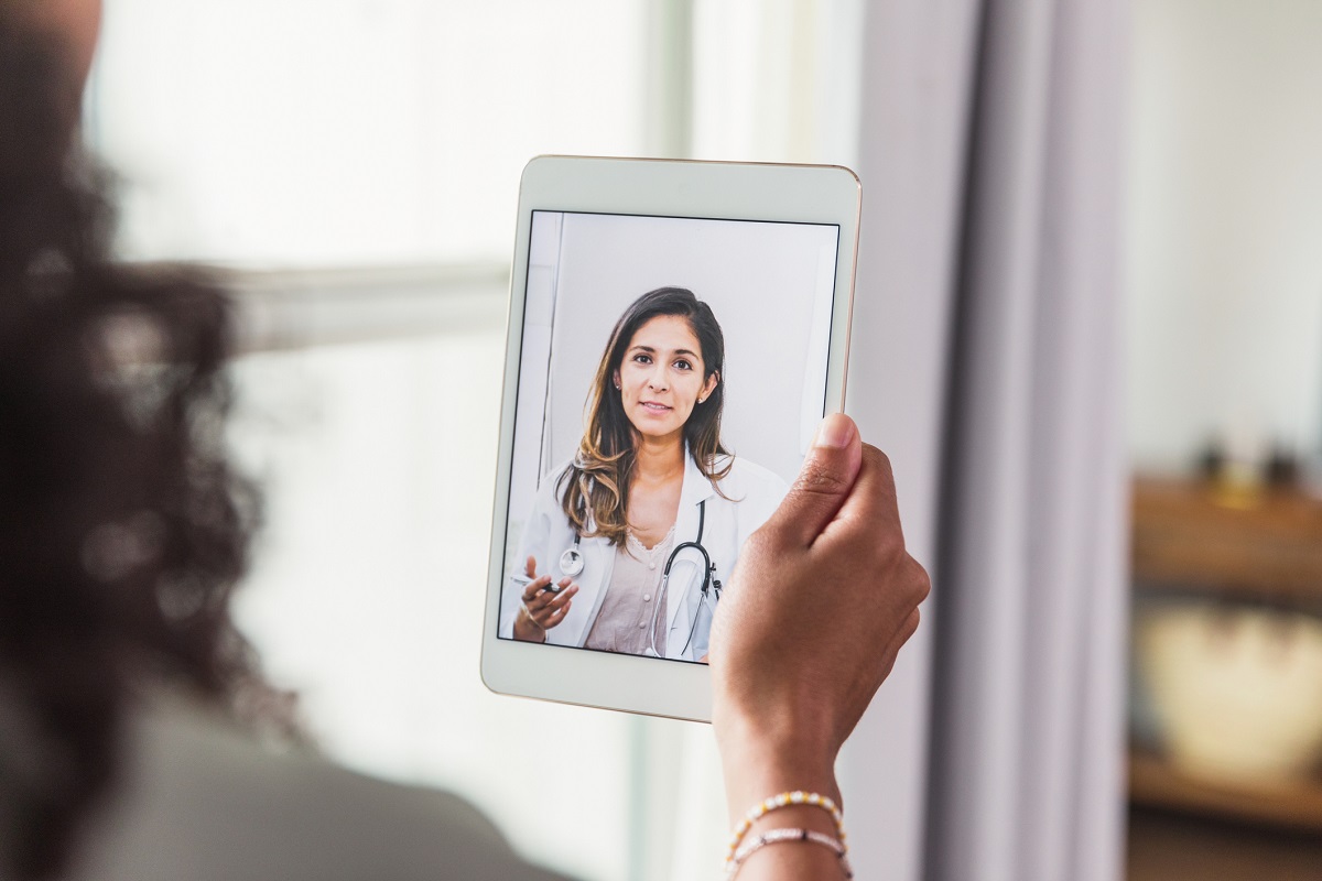 A female doctor a female patient advice during a telemedicine appointment.