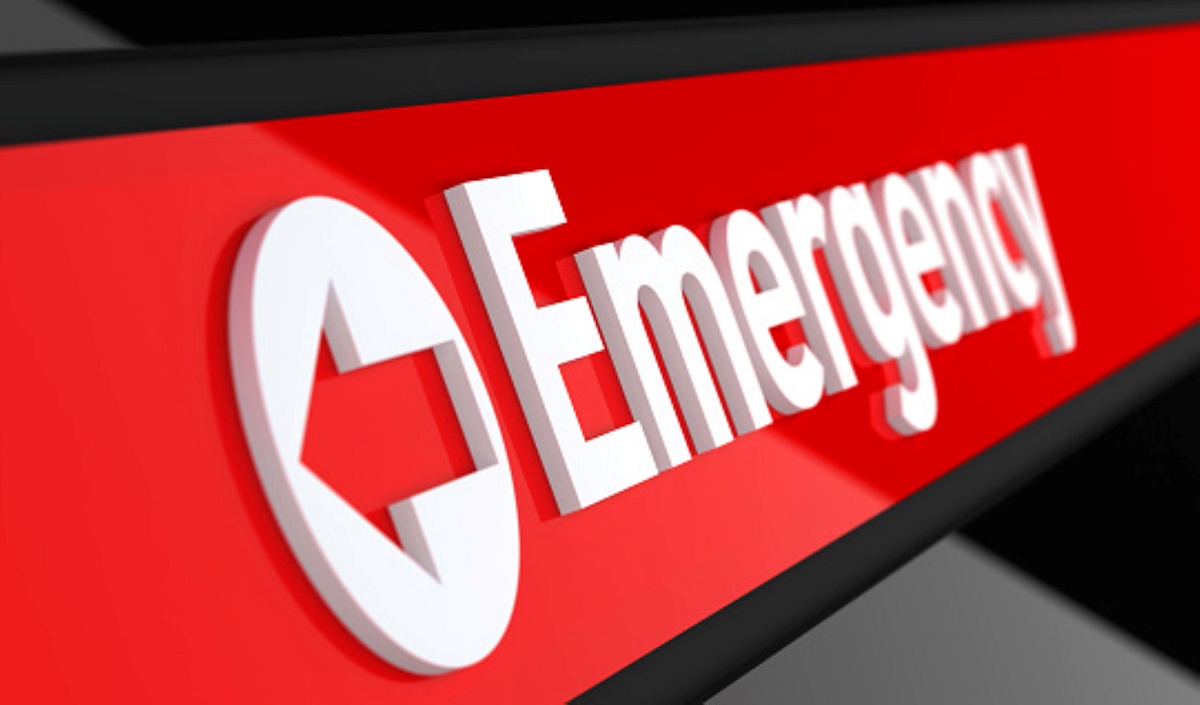 The word Emergency written in large bold letters with an arrow symbol cut out in a circle in front of the word.