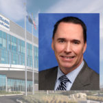 A portrait of Dr. James Leaming is shown superimposed overtop of a photo of Penn State Health Hampden Medical Center.