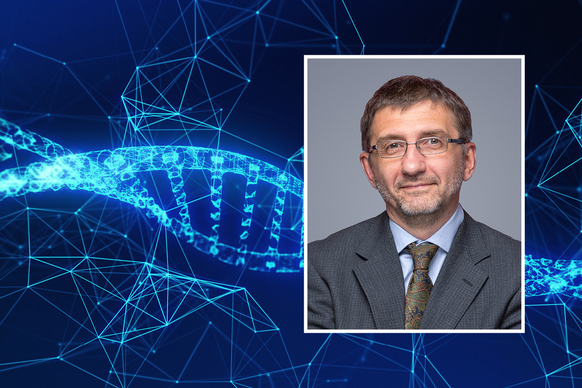 A head and shoulders professional portrait of Nikolay Dokholyan against a background, abstract image of genetic material.