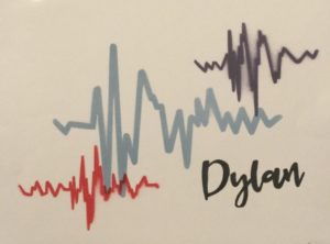 Three spraypainted heartbeats are on a white background, with the name “Dylan” beside them.