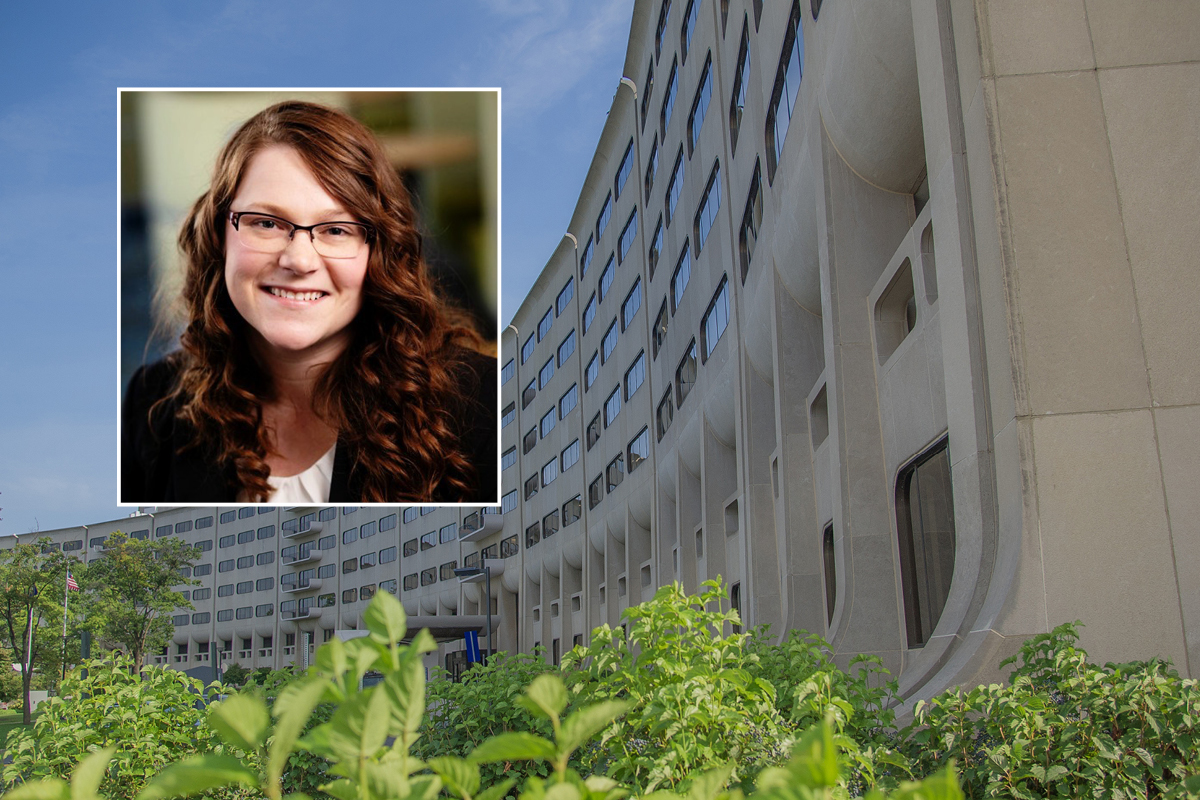 A head and shoulders professional portrait of Dr. Larissa Whitney against a background image of Penn State College of Medicine.