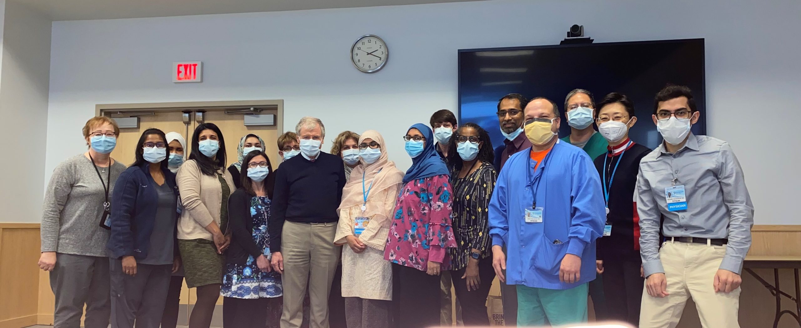 Eighteen members of the Division of Endocrinology, Diabetes and Metabolism stand for a group photo in the University Conference Center.