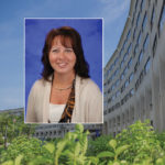A head and shoulders professional portrait of Kelly Karpa against a background image of Penn State College of Medicine.