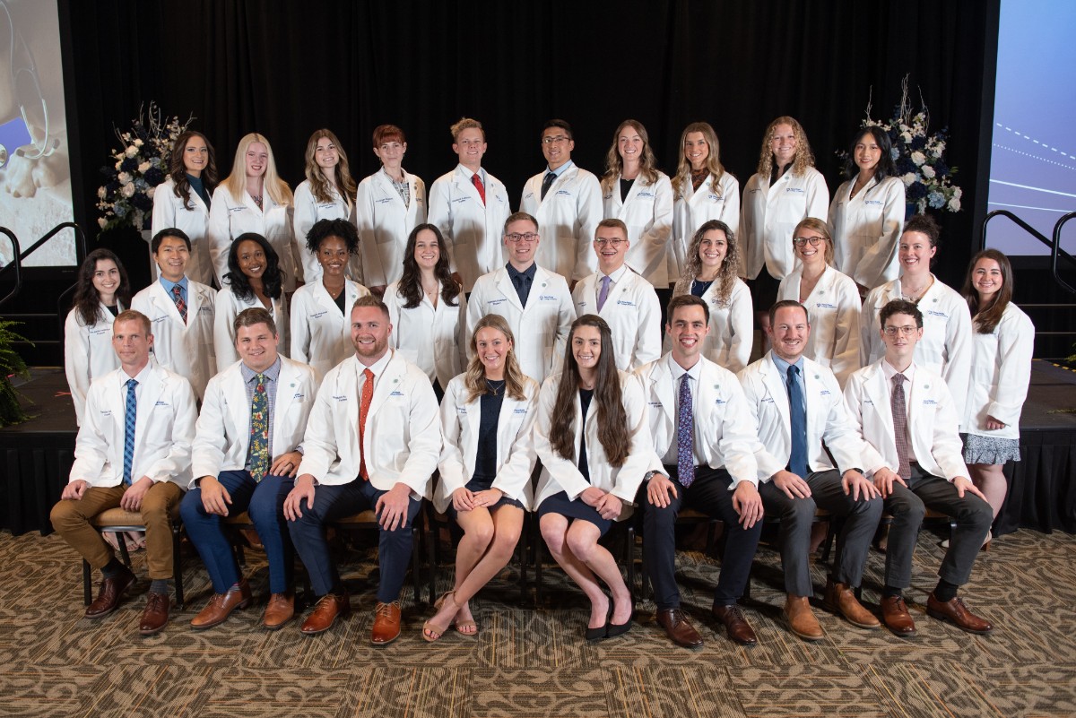 Twenty-nine members of the physician assistant entering class of 2022 pose for a group photo after the White Coat Ceremony.