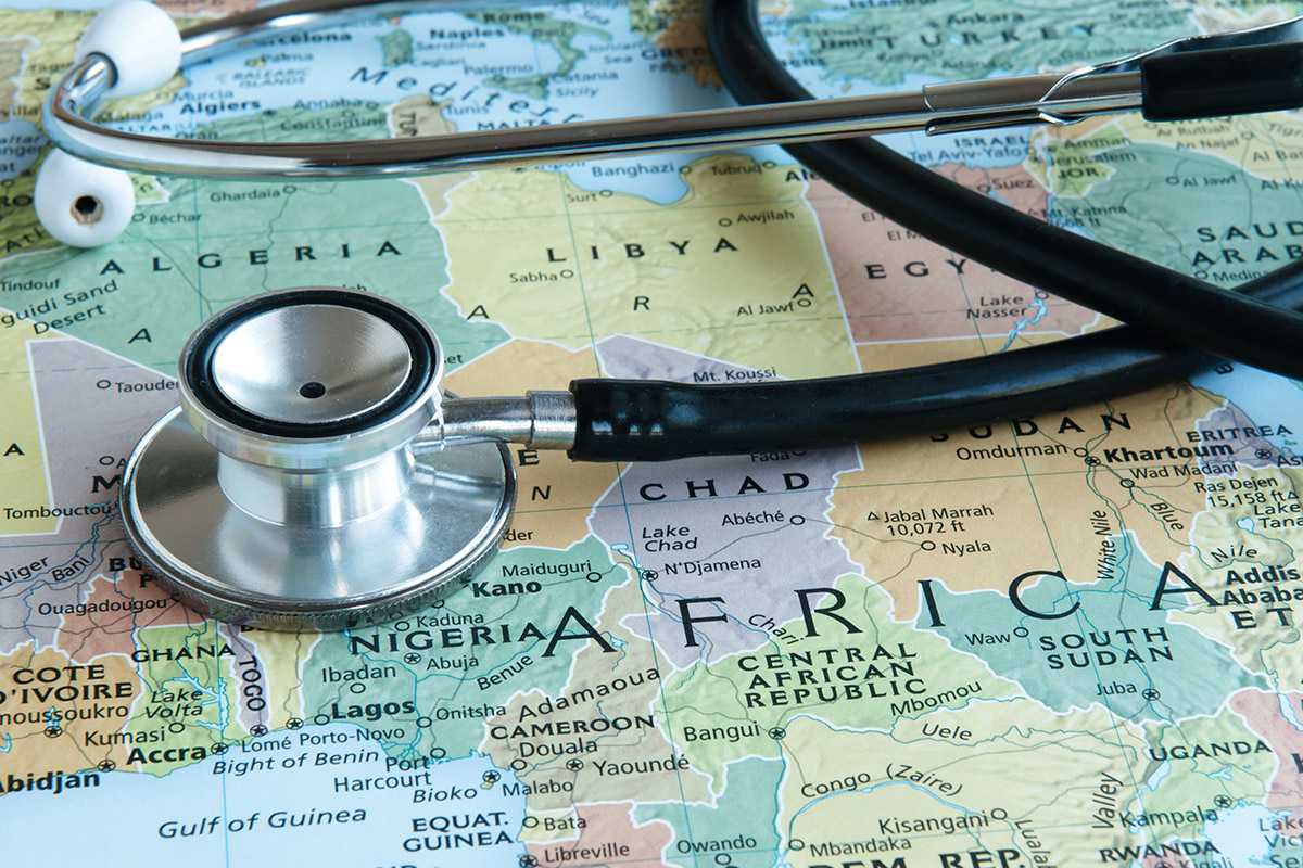 Image shows map of Africa with a stethoscope lying on top of it