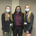From left, students Suzanne Kozloski, Hannah Kline and Rachel Harter pose for a photo wearing masks.