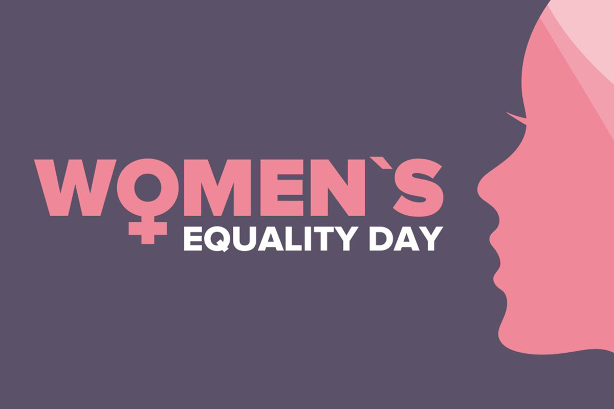 Illustration of woman’s head-and-neck profile next to words “Women’s Equality Day” and symbol for female.