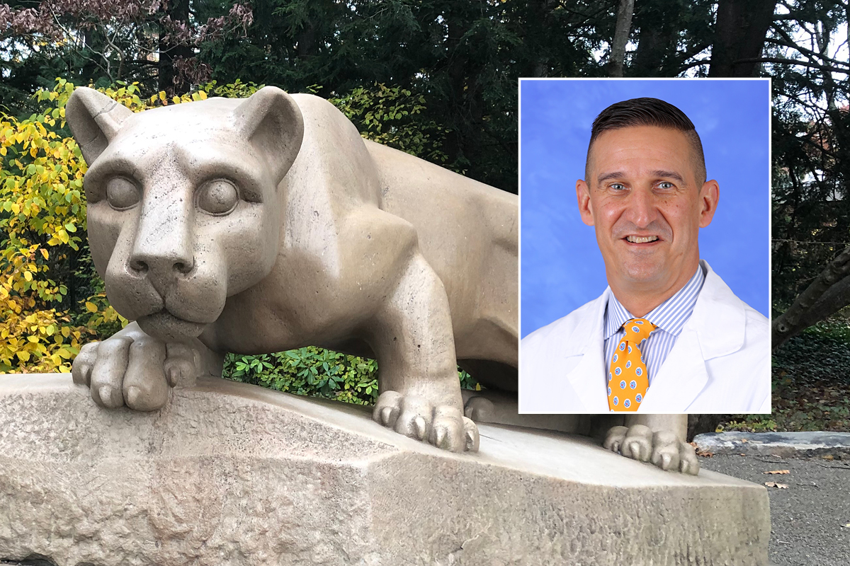 A head and shoulders professional portrait of Dr. Mark Stephens against a background image of the Penn State Nittany Lion shrine at University Park.