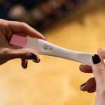 Hands Holding Pregnancy Test Kit