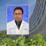A head and shoulders professional portrait of Dr. Pritish Mondal against a background image of Penn State College of Medicine.