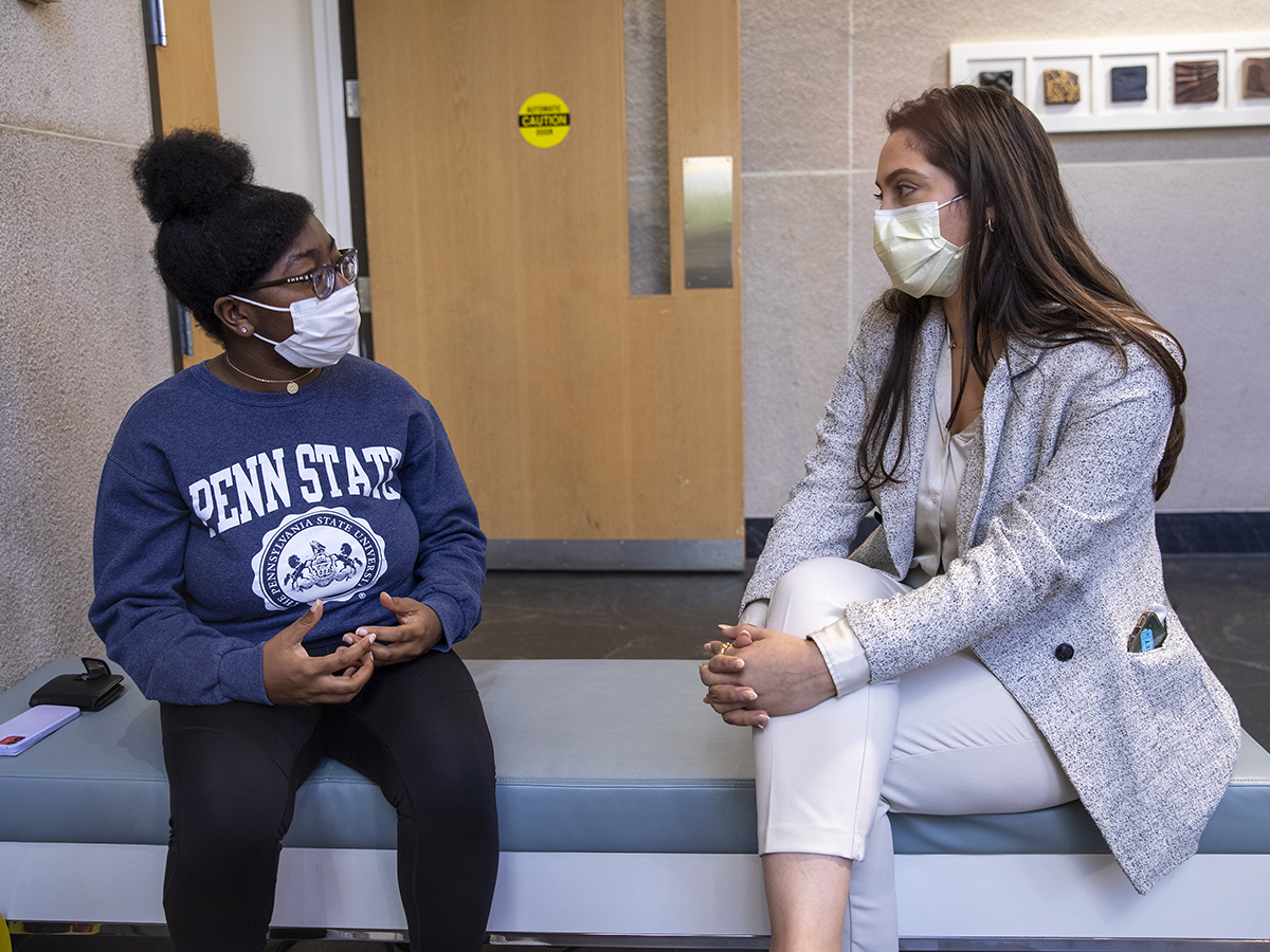 Zari McCullers, a second year PhD student, speaks with Beatrice González, a student advocacy specialist from the Office for Diversity, Equity and Belonging at Penn State College of Medicine.