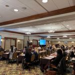 Several rows of people are seated in a conference room, listening to a speaker, at the Inflammatory Bowel Disease Research Symposium on Oct. 14 at the Hershey Lodge.