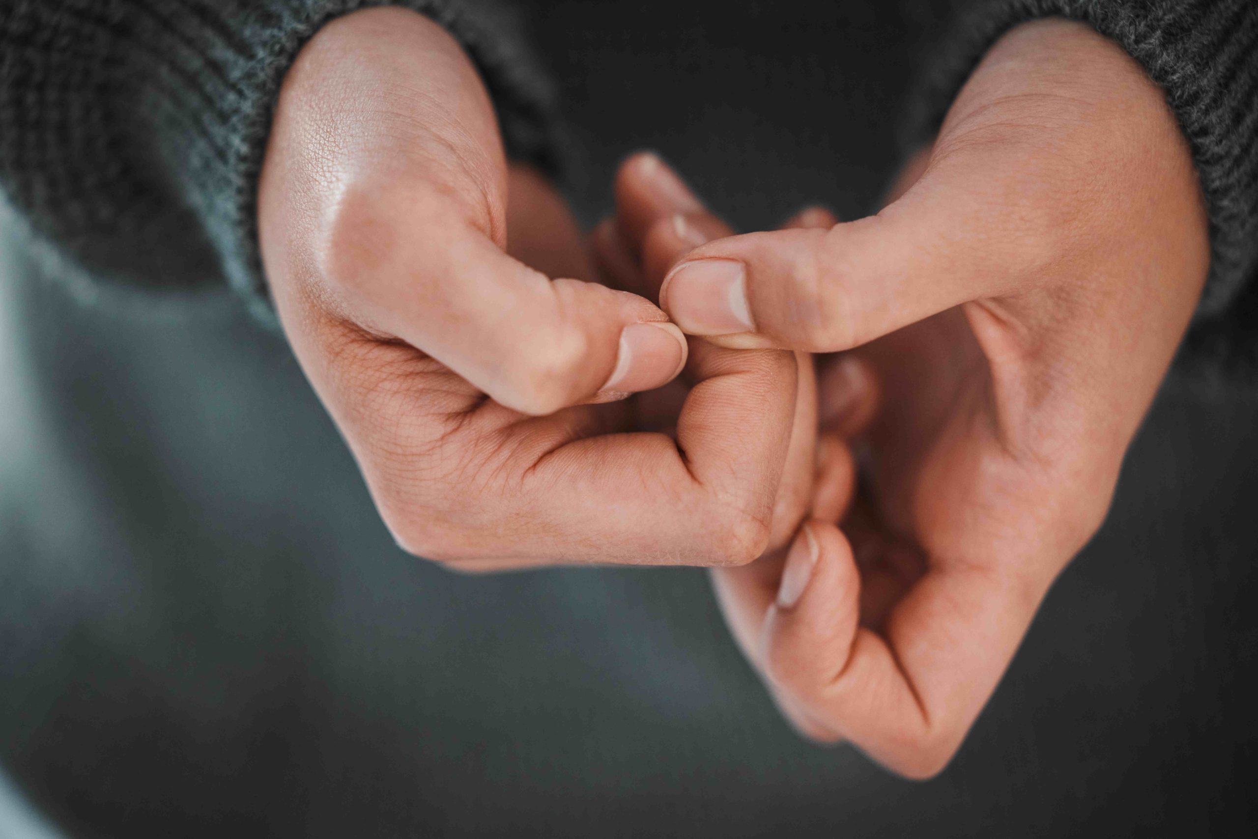 Close-up of a person holding their hands close together.