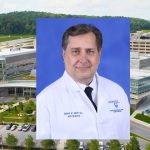 A portrait of Dr. Errol Aksu is superimposed over a a view of Hershey Medical Center.