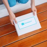 Asian woman patient take covid first aid box self recover health care. customer delivery service from hospital online clinic retail Rx drug store in e-commerce home order.