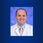 A portrait of Dr. Kevin Rakszawski is shown.