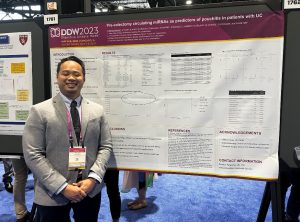 Dr. Ronaldo Panganiban stands beside a poster displaying his research project, “Pre-colectomy circulating miRNAs as predictors of pouchitis in patients with UC,” at Digestive Disease Week.