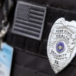 Close-up of a Penn State Health Security badge
