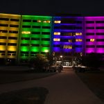 Building lit in blocks of each color of the rainbow.