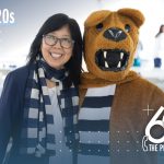 Karen Kim, MD, the College of Medicine's new dean, stands next to the Nittany lion mascot.