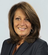 Professional portrait of Deborah-Rice Johnson of Highmark. She is wearing a suit, blouse and earrings.