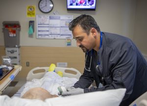 Yasin Dawood, a respiratory therapist at Penn State Health Holy Spirit Medical Center, gives a morning treatment to Glenn Stockenus at Medical Center on Saturday, July 15, 2023.