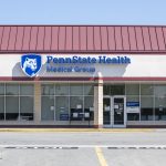 Exterior of Penn State Health Medical Group – Prospect. The building has a bank of windows and is in a strip mall. Its sign reads: Penn State Health Medical Group.