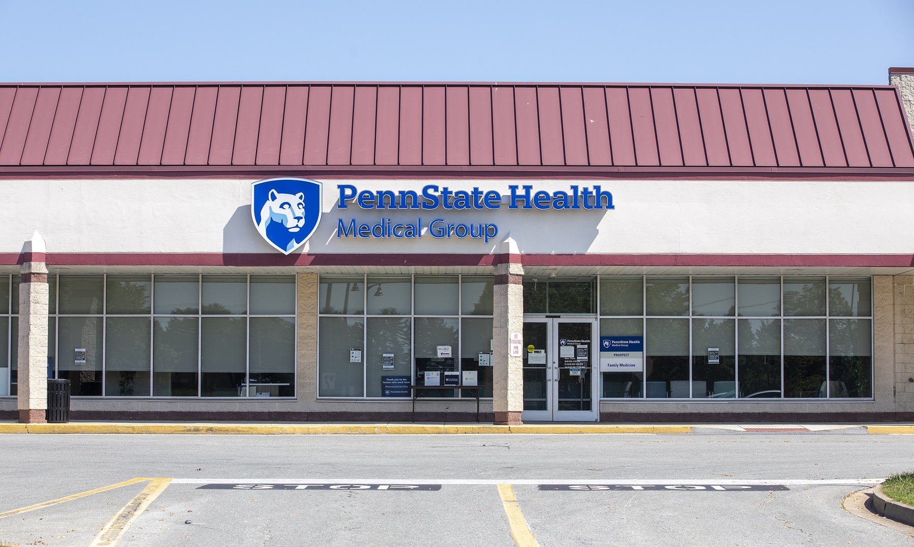 Exterior of Penn State Health Medical Group – Prospect. The building has a bank of windows and is in a strip mall. Its sign reads: Penn State Health Medical Group.
