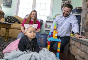 Peter and Abbie Kostishak spend time with their daughter, 1-year-old Julia in their Hummelstown home on Friday, Feb. 24, 2023