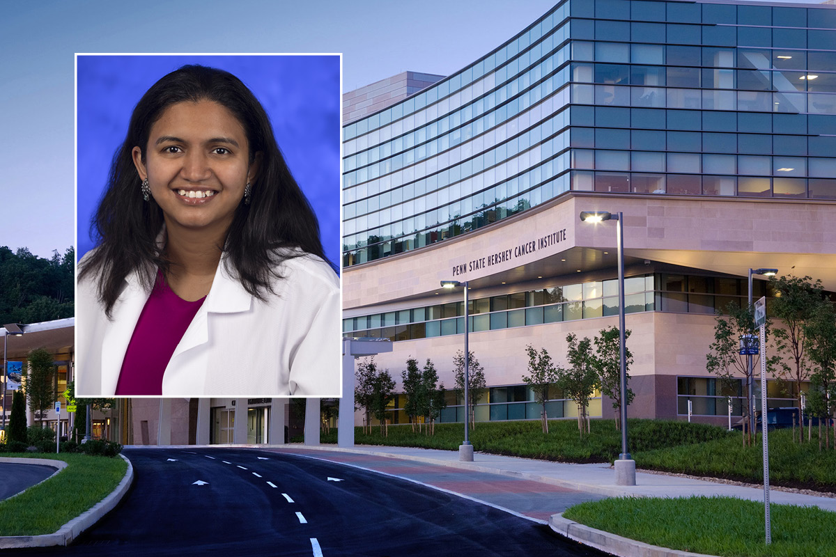 A head and shoulders professional portrait of Dr. Stuthi Perimbeti against a background image of Penn State Cancer Institute.