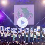 People on stage at THON hold up numbers to show how much was raised in 2024: $16,955,683.63.