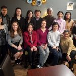 Group photo of 14 people taking part in the Asian Physician and Professional Association Lunar New Year celebration.