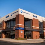 Office building on a corner – brick and cement with large dark windows. Signs on the building say, “2605” “Penn State Health” and “Berks Cardiology.”