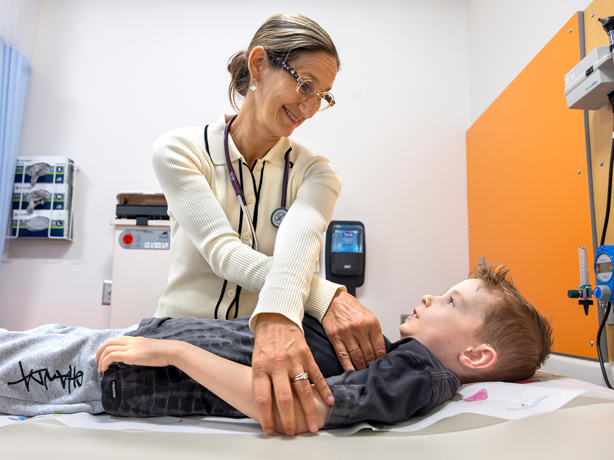 A doctor examines a pediatric patient