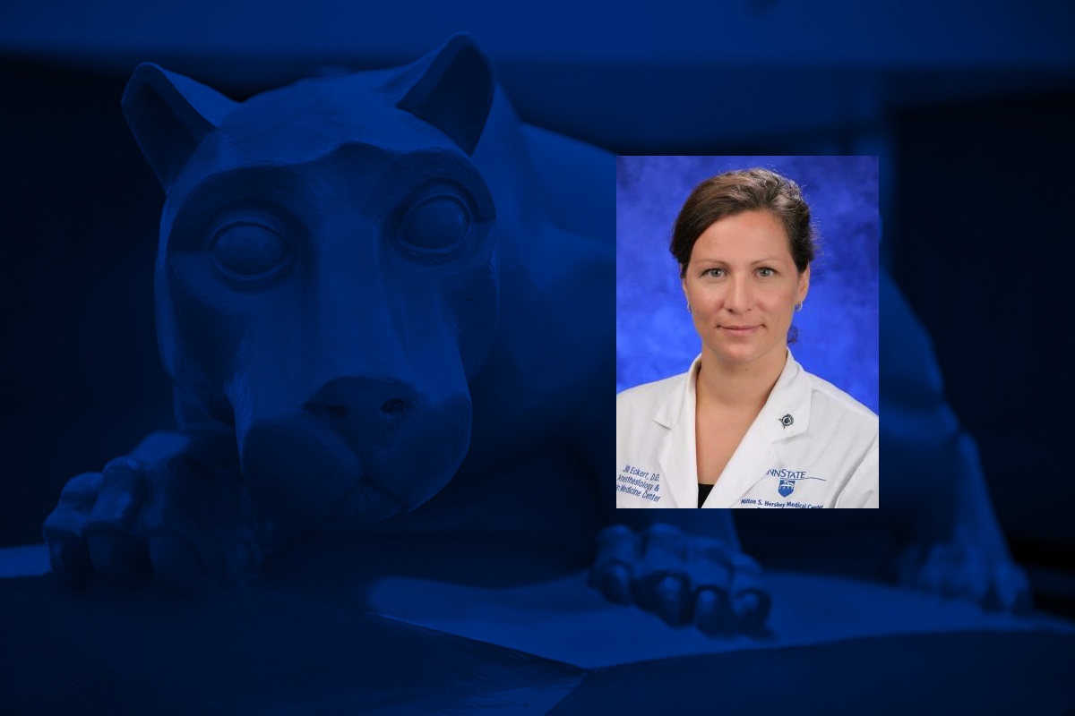 A photo of a women smiling for a headshot is overlaid on a graphic with a statue of a lion mascot