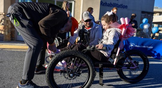 Penn State Health presents adaptive bike to young girl recovering from tragic accident