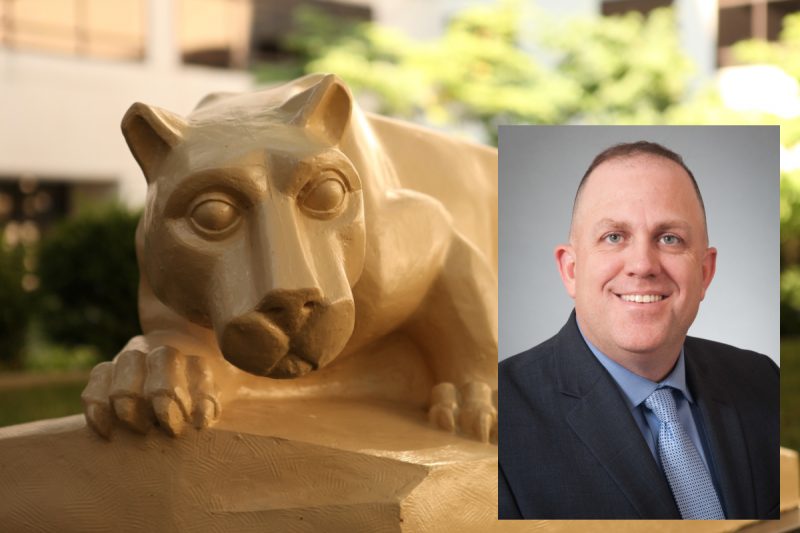 A headshot of Sam Wetherill, wearing a suit and tie, superimposed over a larger photo of a Penn State Nittany Lion statue.