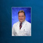 Headshot of gentleman physician in doctor's coat