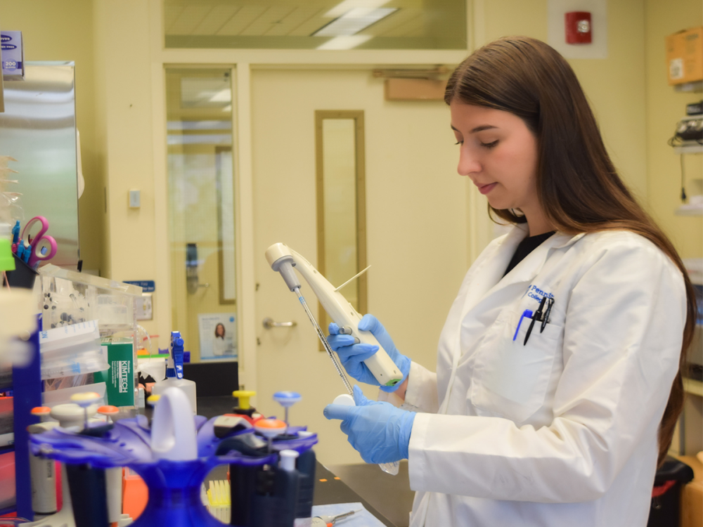 Research scientist preparing experiments in a lab.