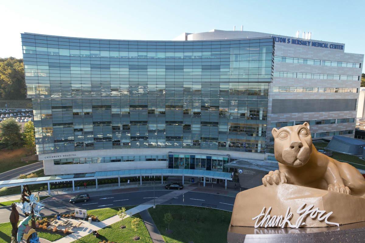 A statue of the Penn State Nittany Lion with the words