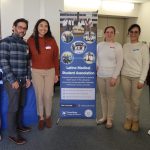 Student leaders pose with banner