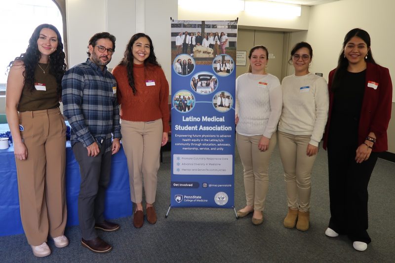Student leaders pose with banner