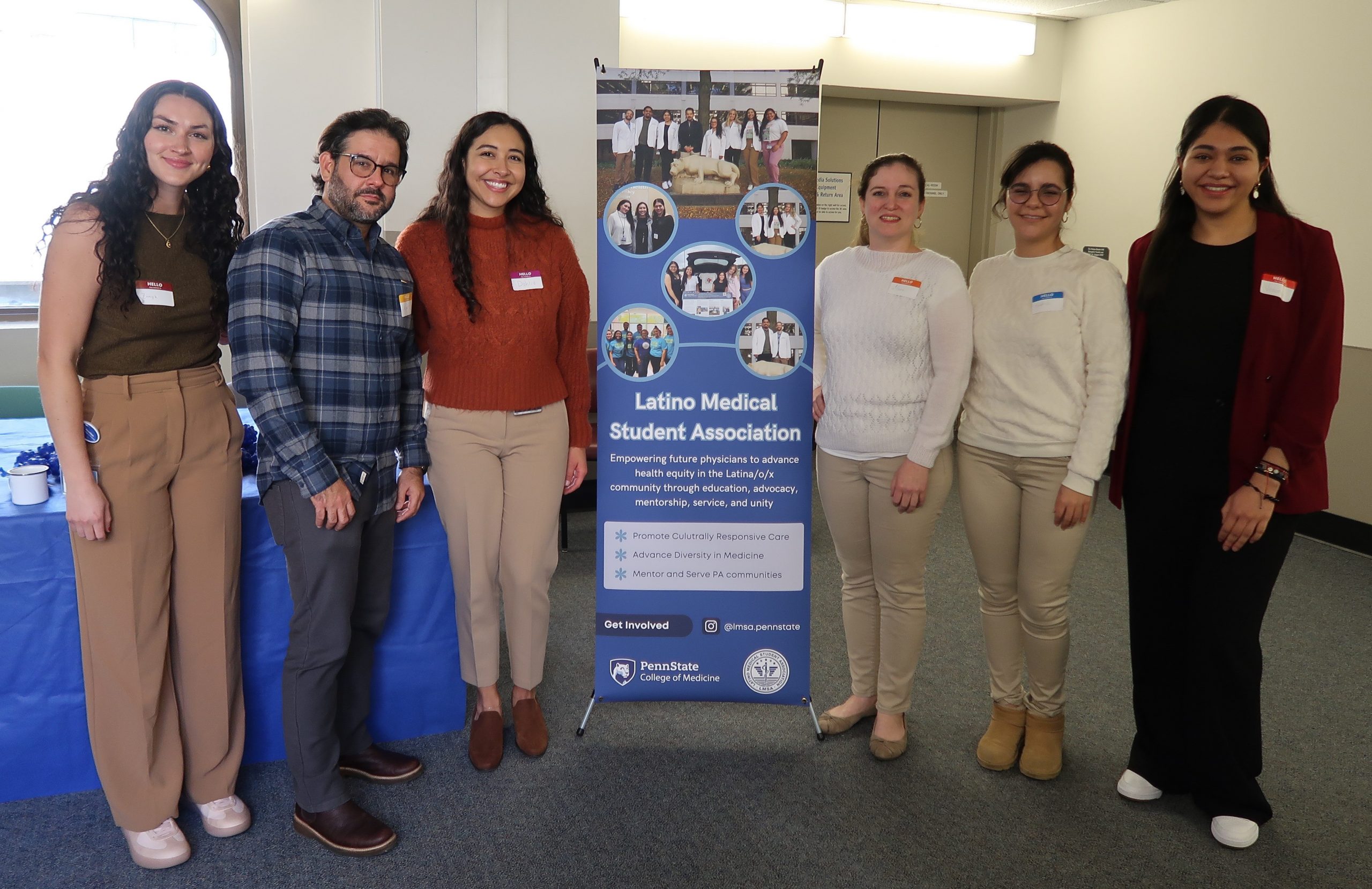 Student leaders pose with banner