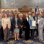 Dr. Sarah Inés Ramírez, fourth from right, stands with lawmakers in the Pennsylvania Senate Chamber.