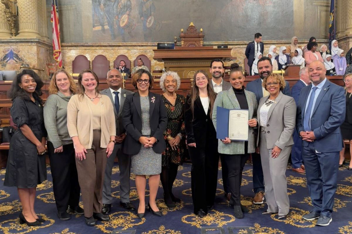 Dr. Sarah Inés Ramírez, fourth from right, stands with lawmakers in the Pennsylvania Senate Chamber.