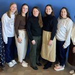 Seven members of the Pediatric Intermediate Care Unit at Golisano Children’s Hospital smile in a group photo.