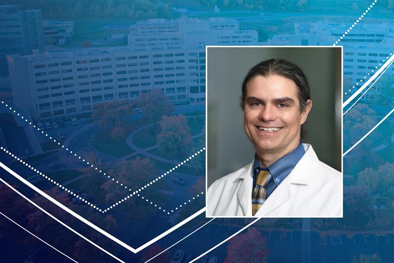 A professional headshot of Jason Mills, MD, PhD