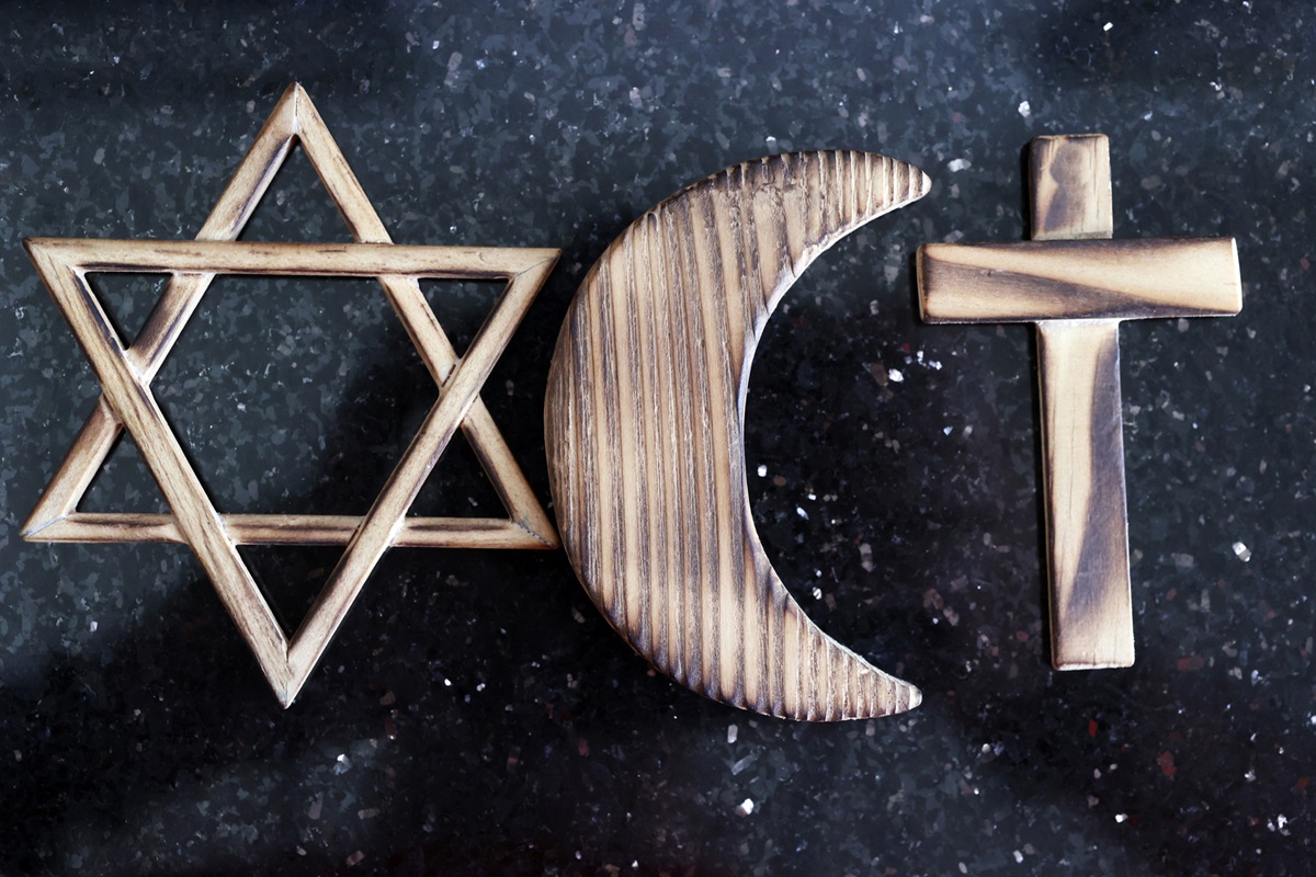 Christianity, Islam and Judaism symbols, three monotheistic religions, Jewish Star of David, Christian Cross and Muslim Crescent.