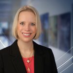 Jennifer Kraschnewski, MD, MPH, poses for a professional portrait in front of a blurred indoor background.